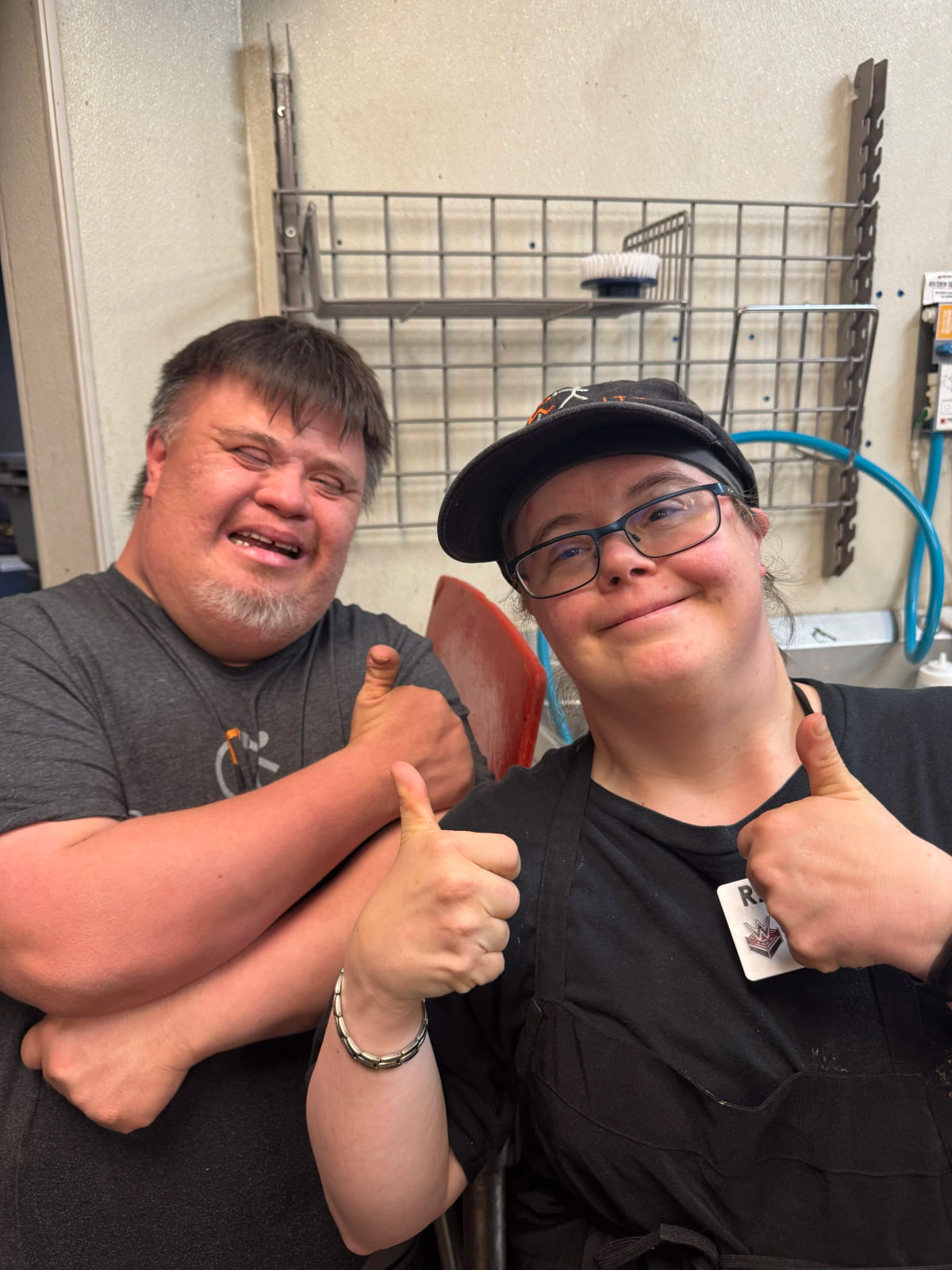 José and Rachel together in the Brewability kitchen, both giving a thumbs up to the camera.