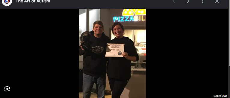 Tiffany Fixter and another person holding an award certificate together at Pizzability.